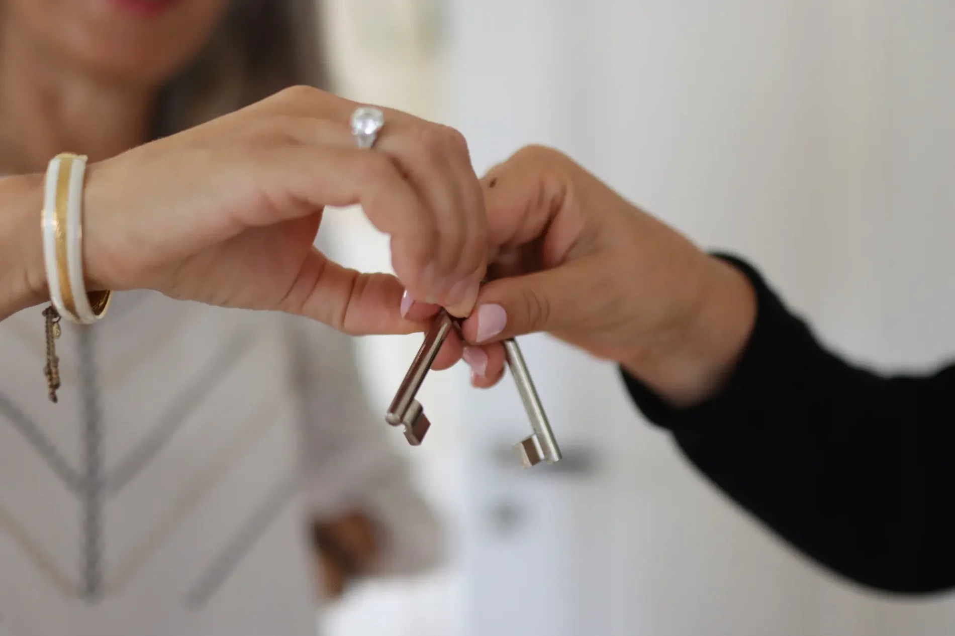A client receiving the keys to a property